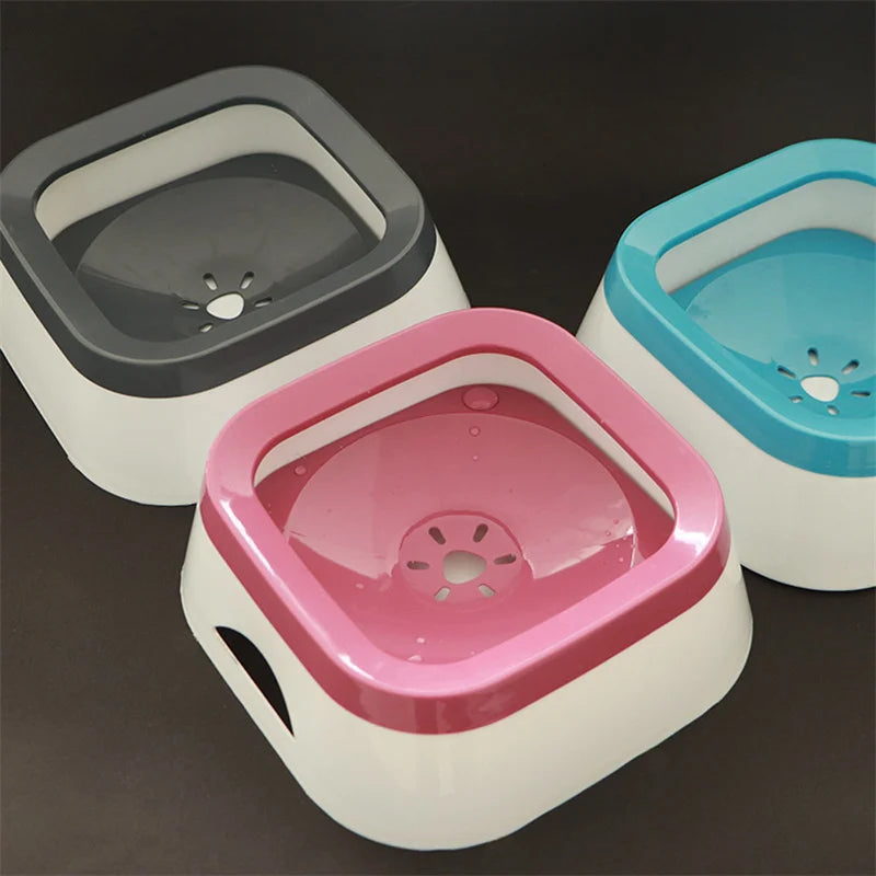 Colorful plastic pet water bowls in gray, pink, and blue with a modern design, perfect for ensuring hydration.